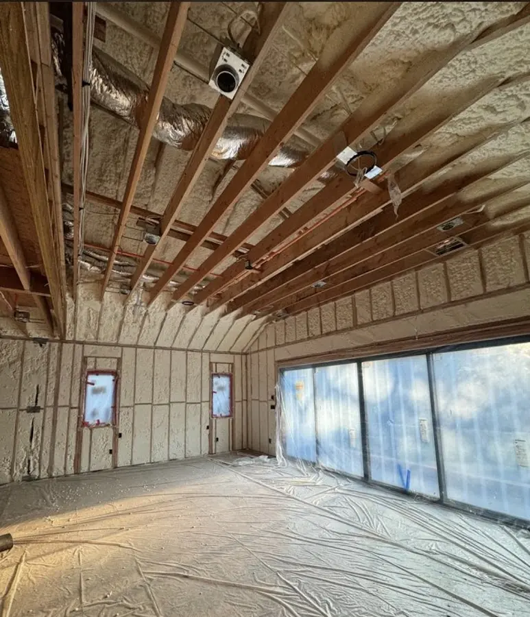 Interior walls and ceiling insulated with spray foam during new construction in Hanover